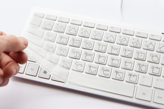 ELIA tactile keyboard cover shown laid over a regular keyboard.